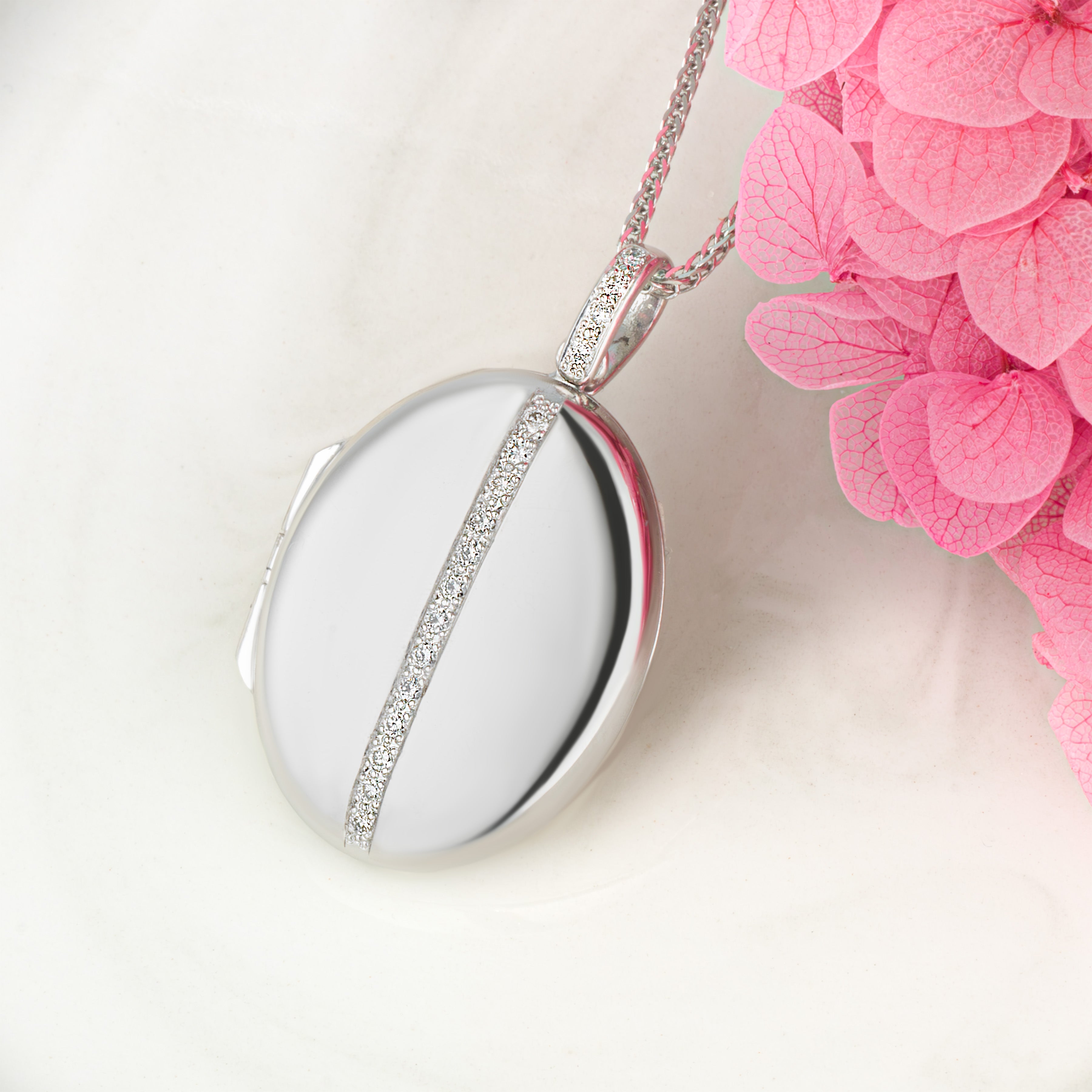 This is a relax shot for 18 ct Contemporary White Gold and Diamond Locket with a 18ct Spiga Chain.