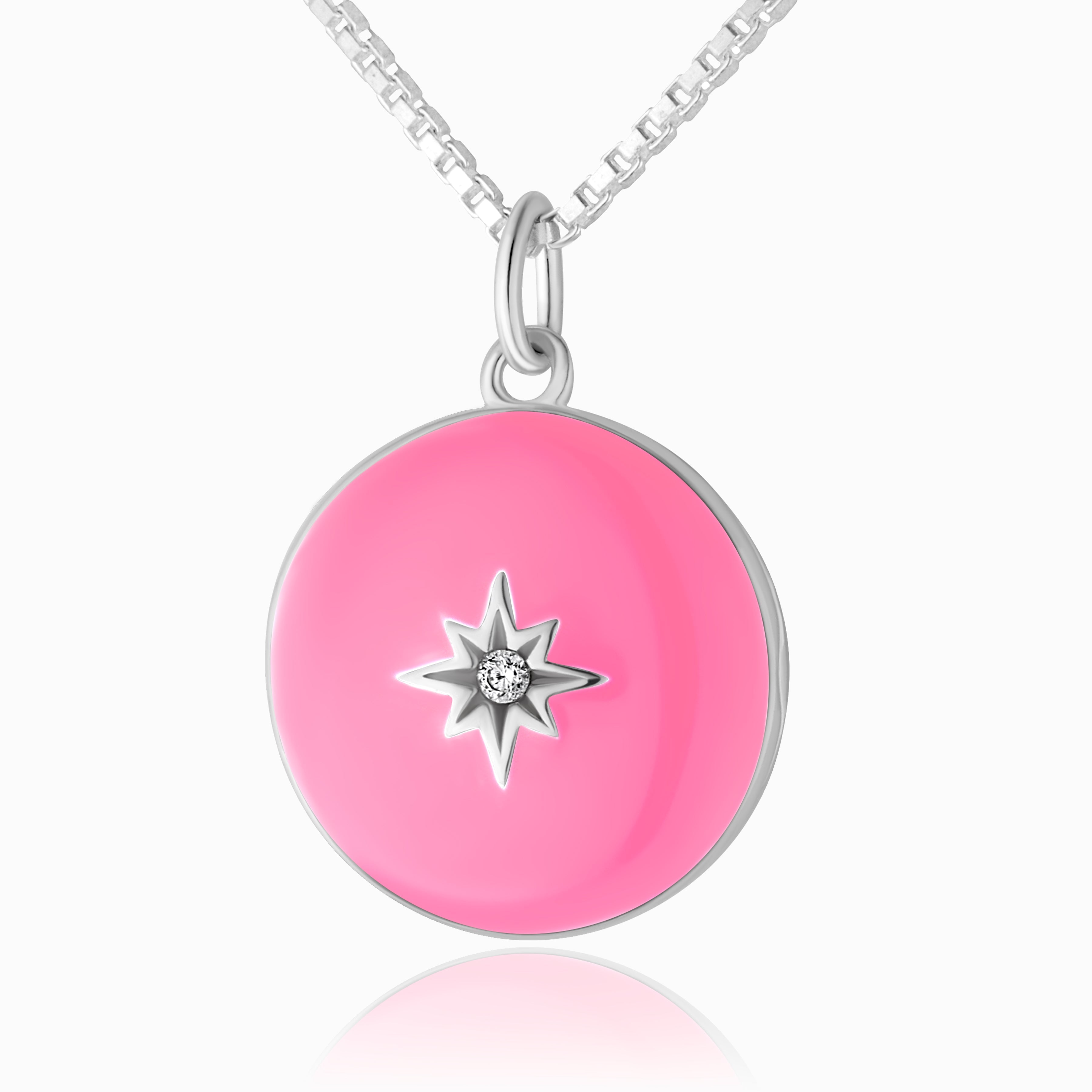 a close up photo of a 925 sterling silver round locket with a hot pink enamel base, and star set in the middle with a cubic zirconia stone.