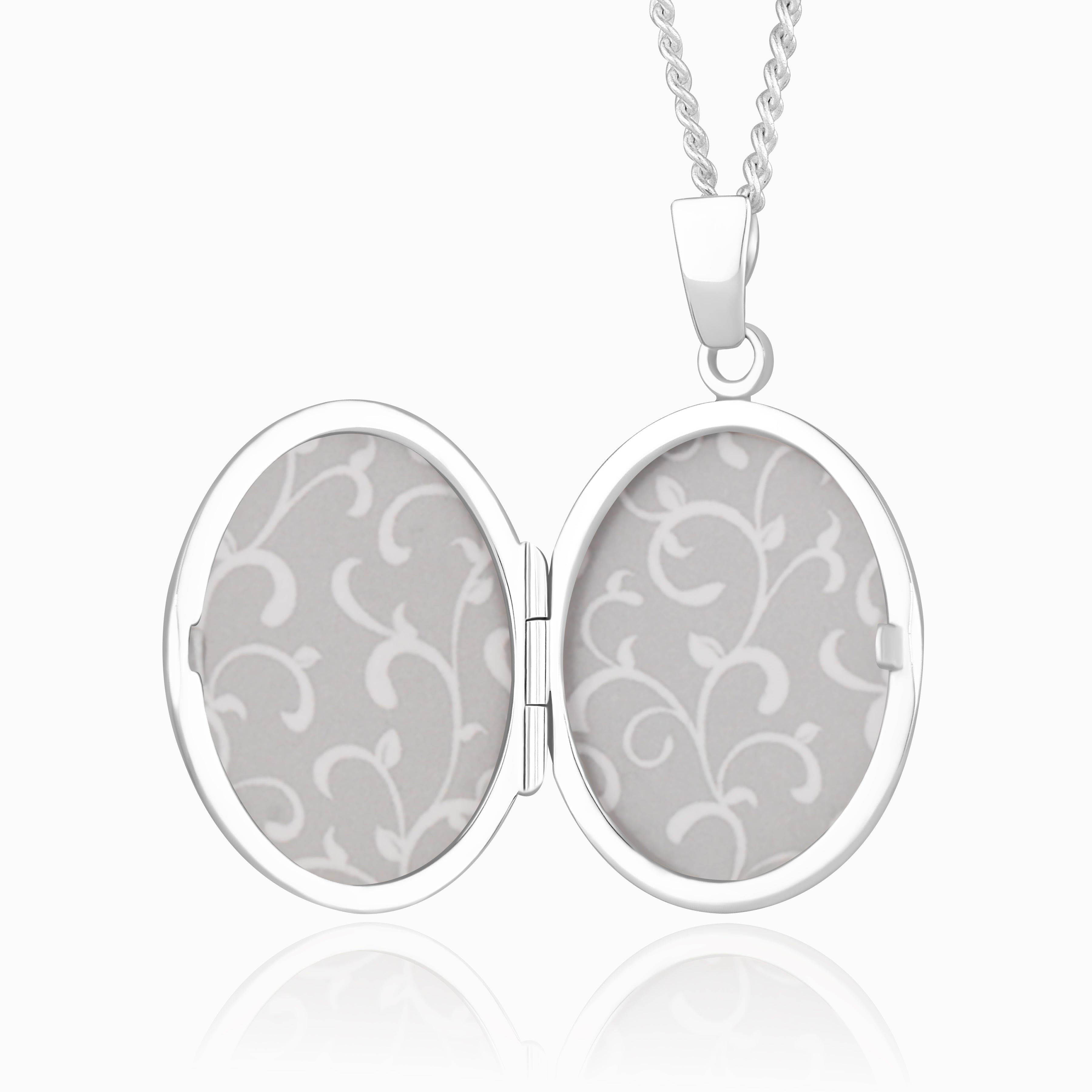 photo of the inside of a 925 sterling silver locket on a curb chain.