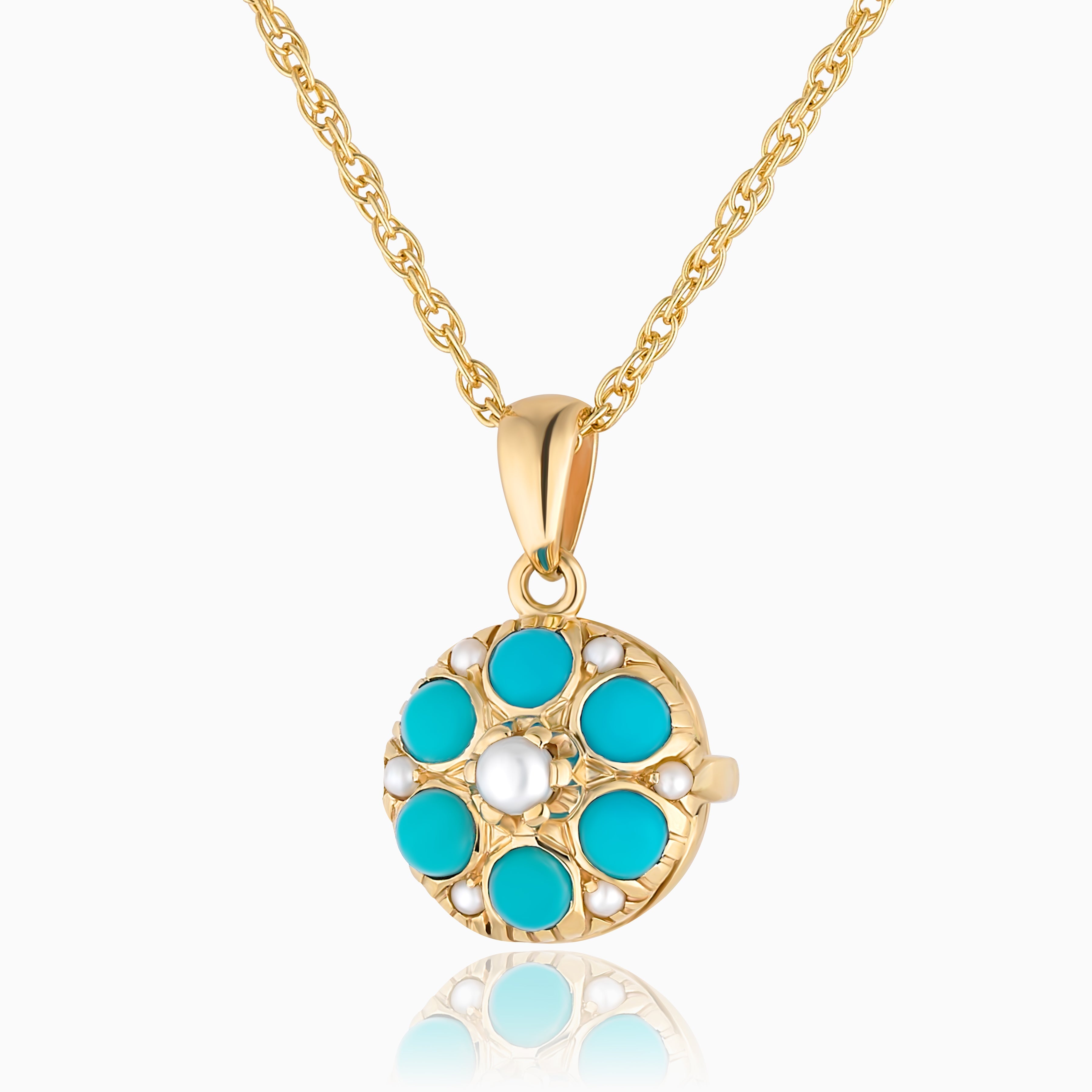 Photo of a round 9 ct gold locket with real round turquoise and matching pearls spread throughout and placed on a modern 9ct gold base. Matched with a 9ct gold rope chain.