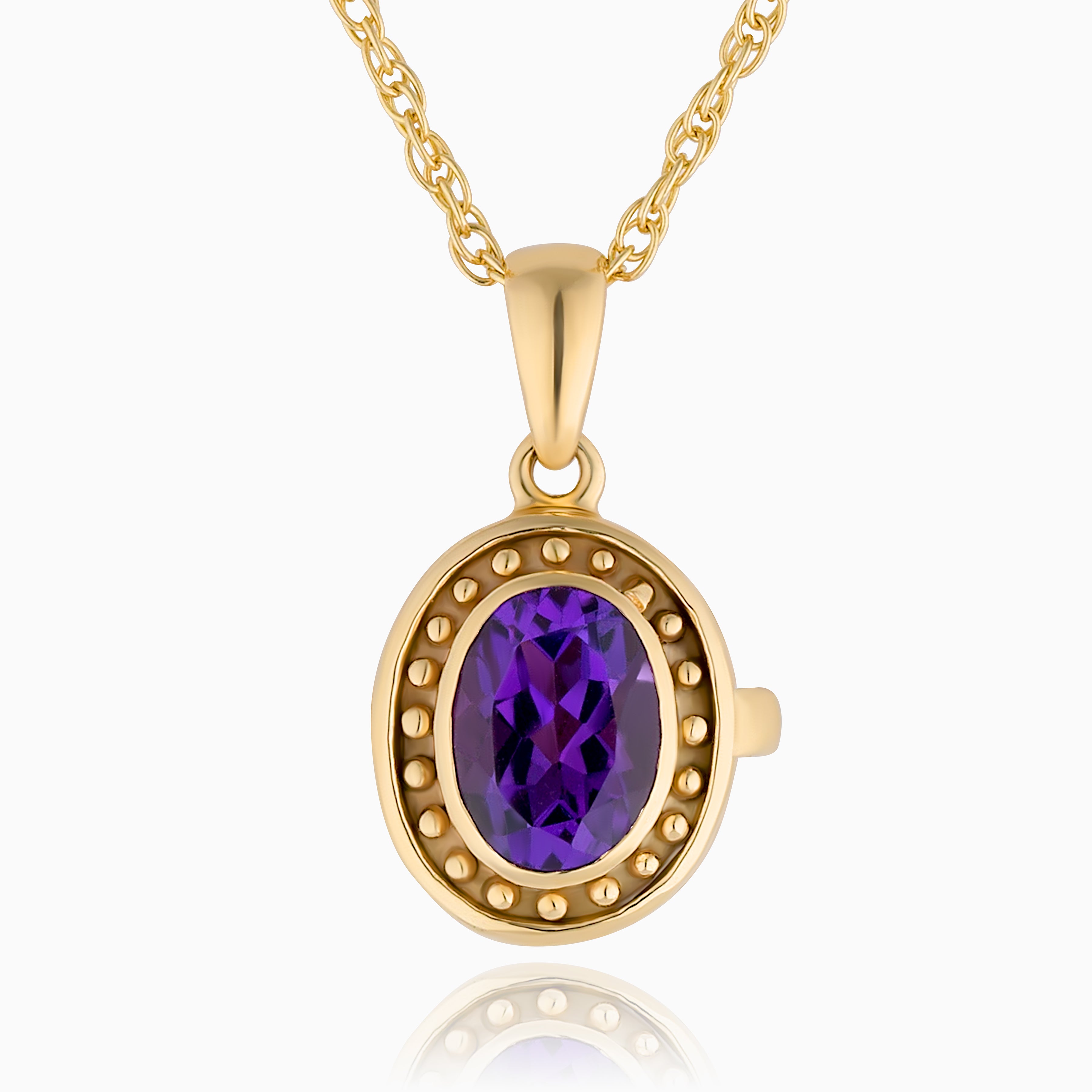 Close up photo of a 9 ct gold locket with a vibrant purple amethyst in the middle and surrounded by gold beads on the edge of the locket and placed on a 9ct rope chain.