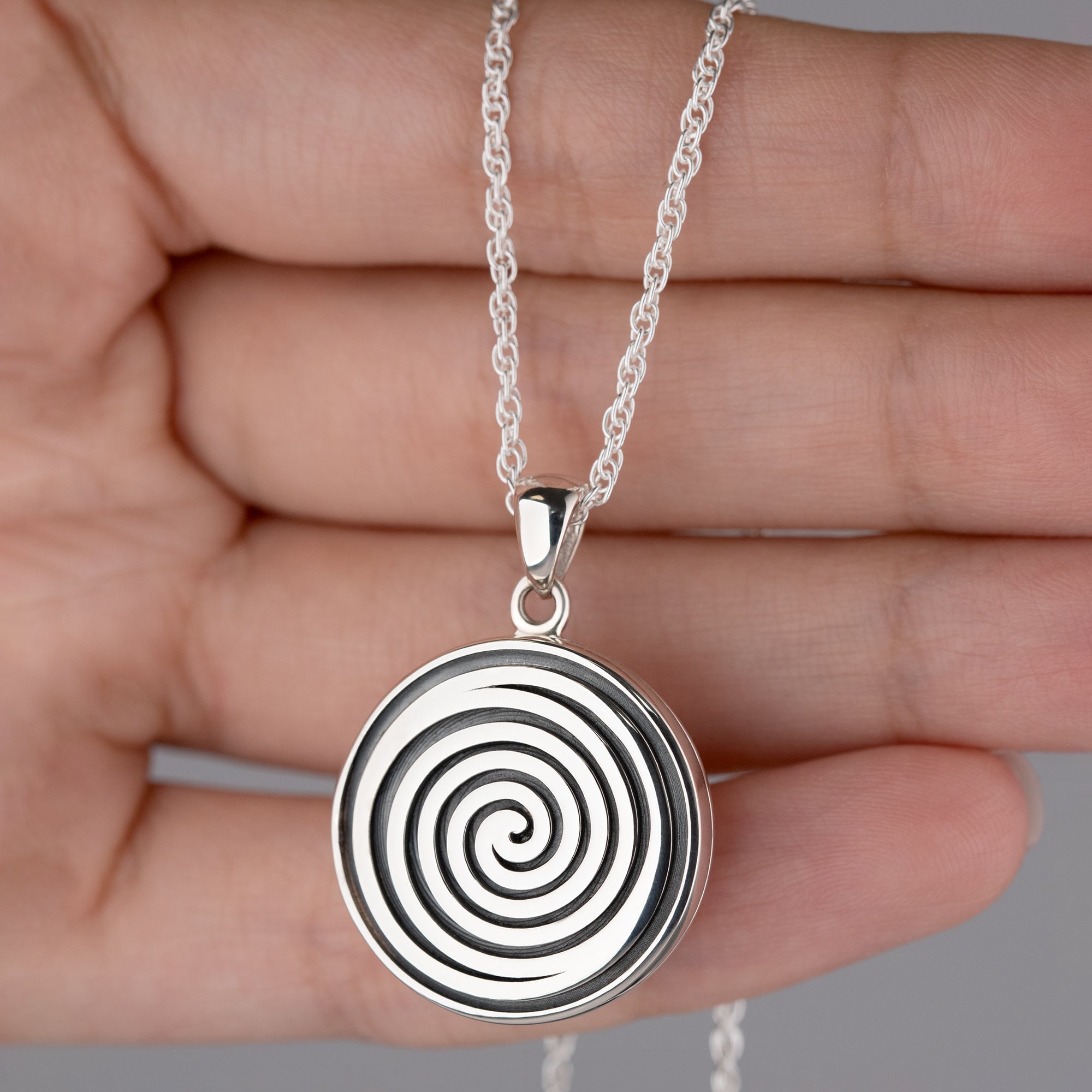 Product title: Round Black and Silver Spiral Locket, product type: Locket