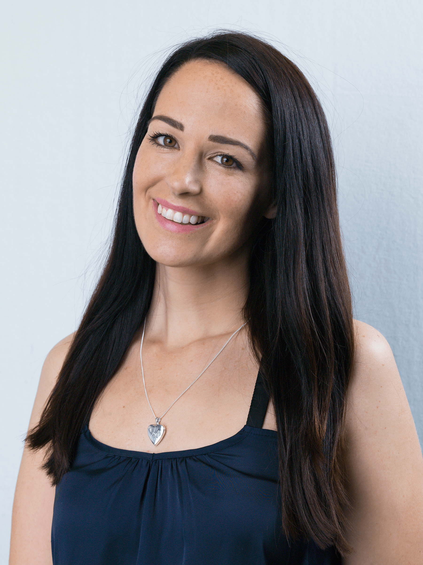 A model wearing a 925 sterling silver Diamond Mum Locket, on a curb chain