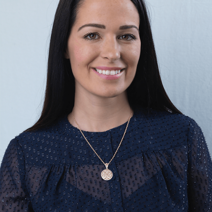 Model wearing a 9 ct gold round locket set with 56 diamonds on a 9 ct gold rope chain