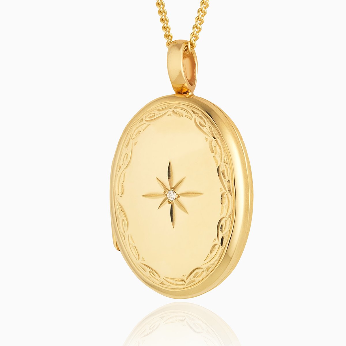 Large 9 ct gold oval locket with an engraved border and diamond on a 9 ct gold curb chain.