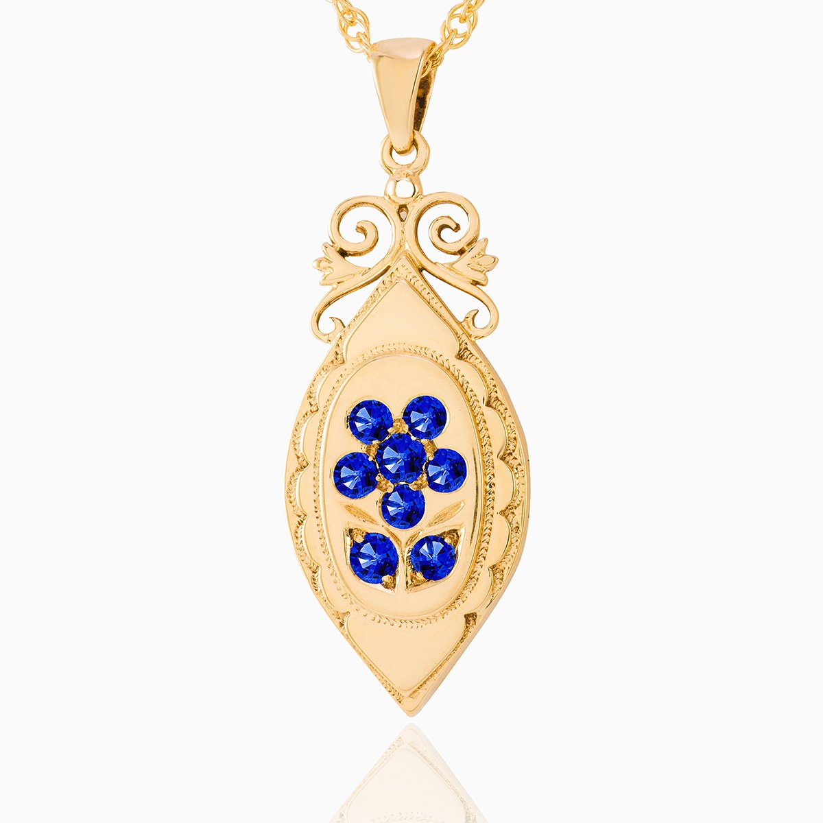 An elongated 9 ct gold locket set with sapphires on a 9 ct gold rope chain