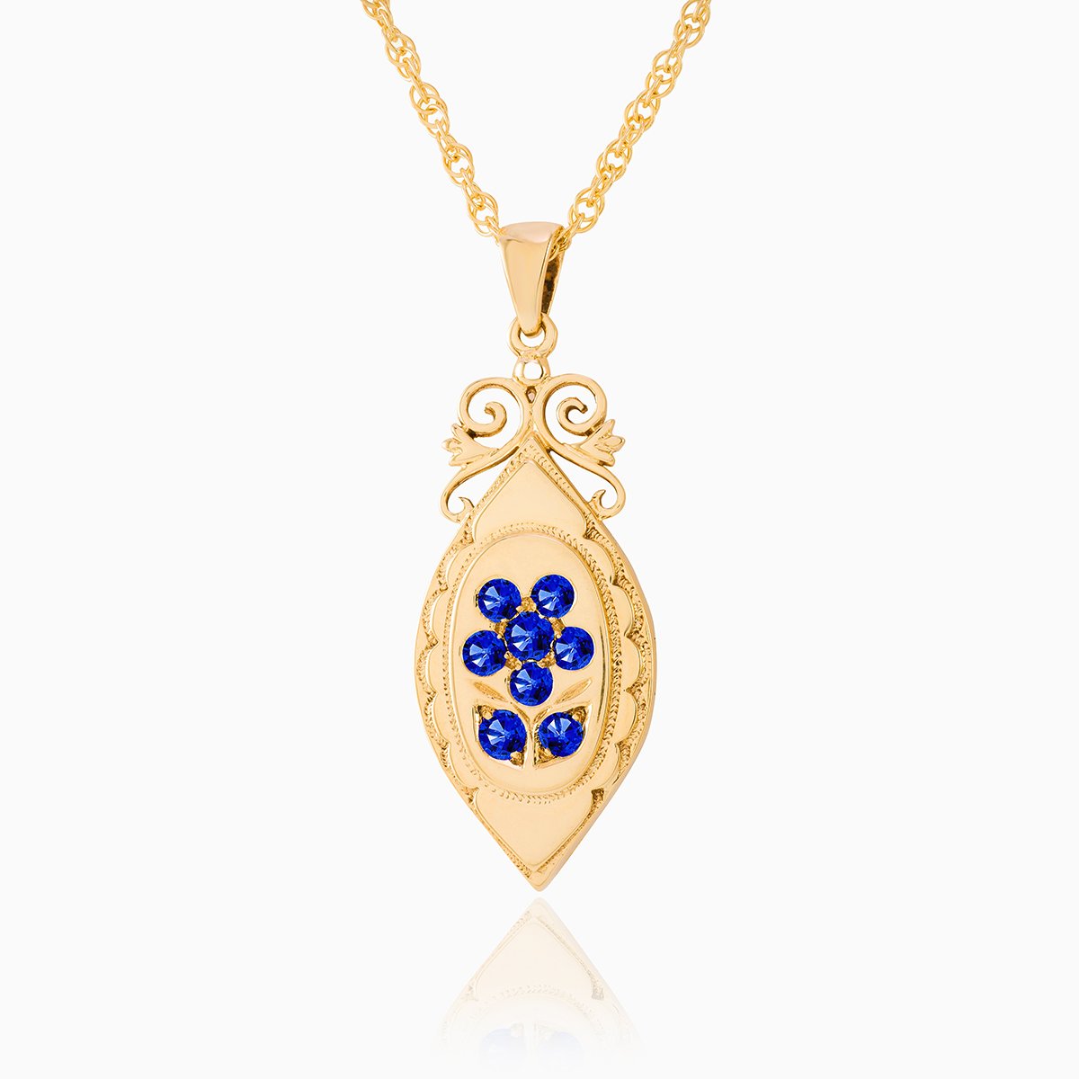 An elongated 9 ct gold locket set with sapphires on a 9 ct gold rope chain