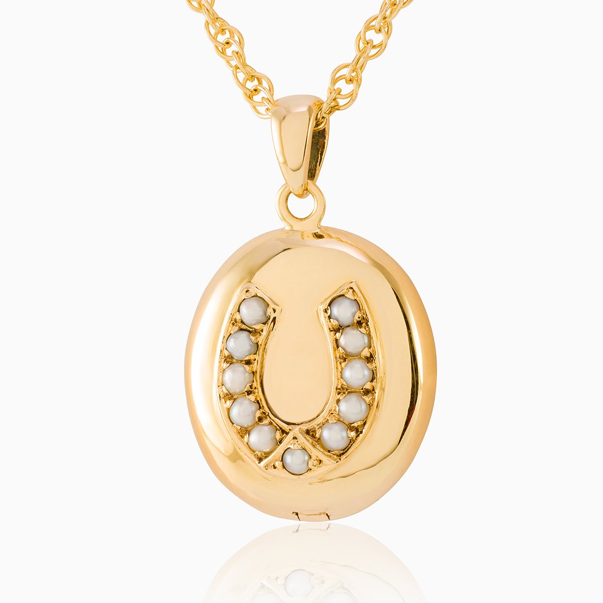 9 ct gold oval locket set with seed pearls in a horseshoe design on a 9 ct gold rope chain