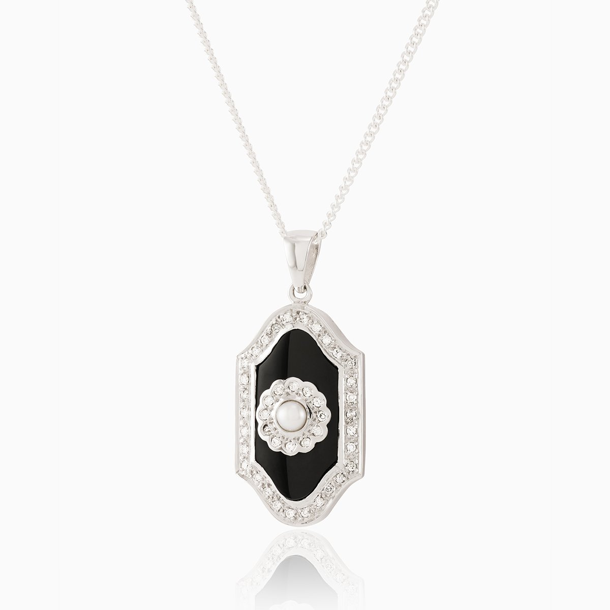 9 ct white gold plaque locket set with an onyx plaque surrounded by diamonds and a seed pearl in the middle surrounded by diamonds. On a 9 ct white gold curb chain