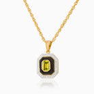 9 ct gold tabular shaped locket set with black onyx, green peridot and diamonds on a 9 ct gold rope chain