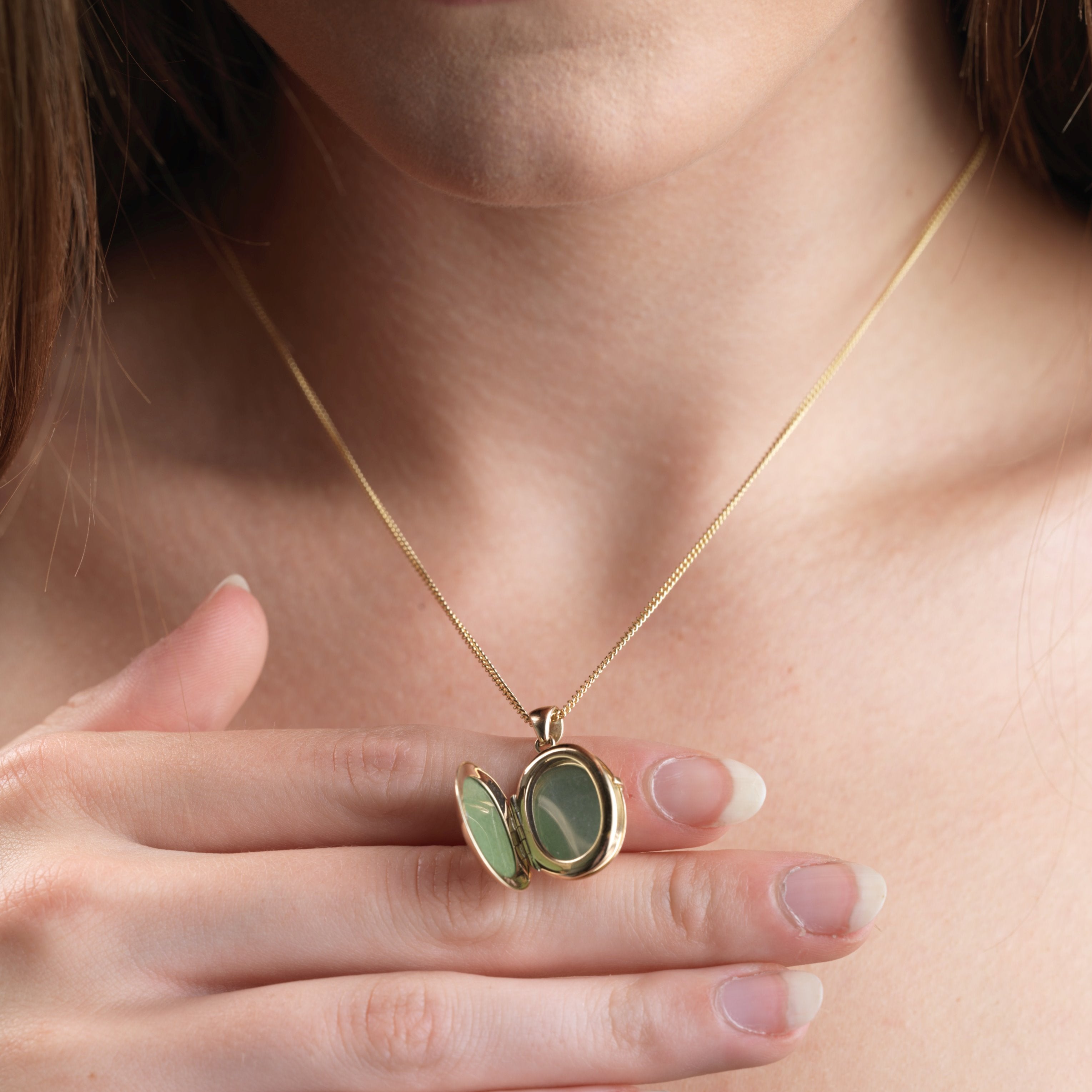 Product title: Dainty Gold Sapphire 4-Photo Locket, product type: Necklaces