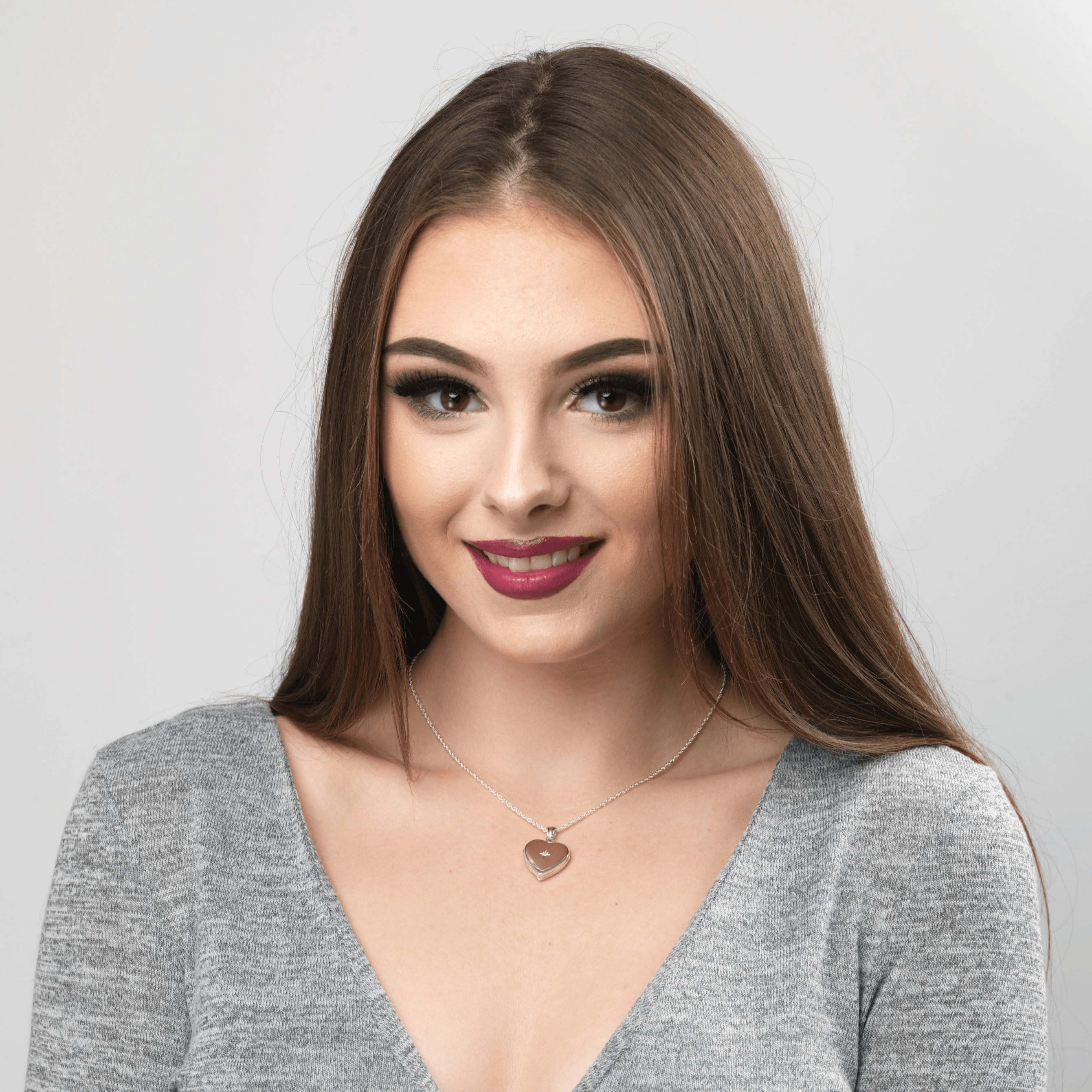 Model wearing a Sterling silver 925 heart locket set with a diamond.