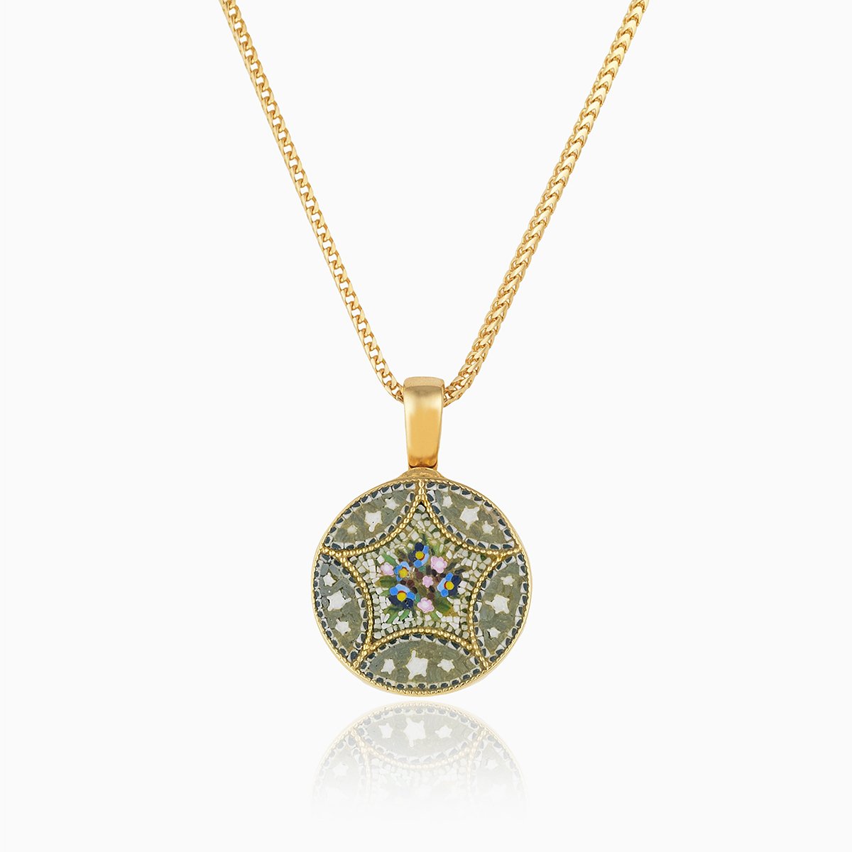18 ct round gold locket set with a micromosaic floral design on an 18 ct gold franco chain