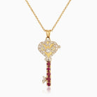 18 ct gold locket in the shape of a key set with diamonds and rubies, on an 18 ct gold trace chain