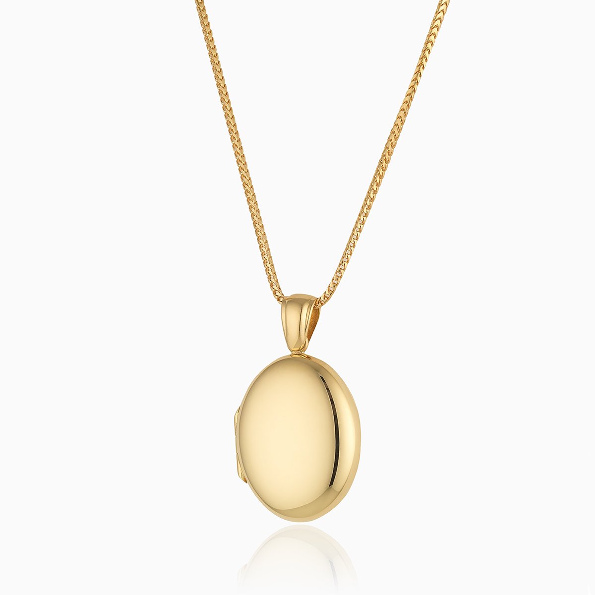 18 ct gold oval locket on an 18 ct gold franco chain