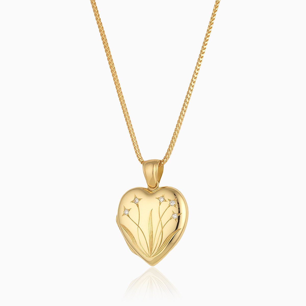 18 ct gold heart locket set with diamonds and engraved with a floral design, on an 18 ct gold franco chain