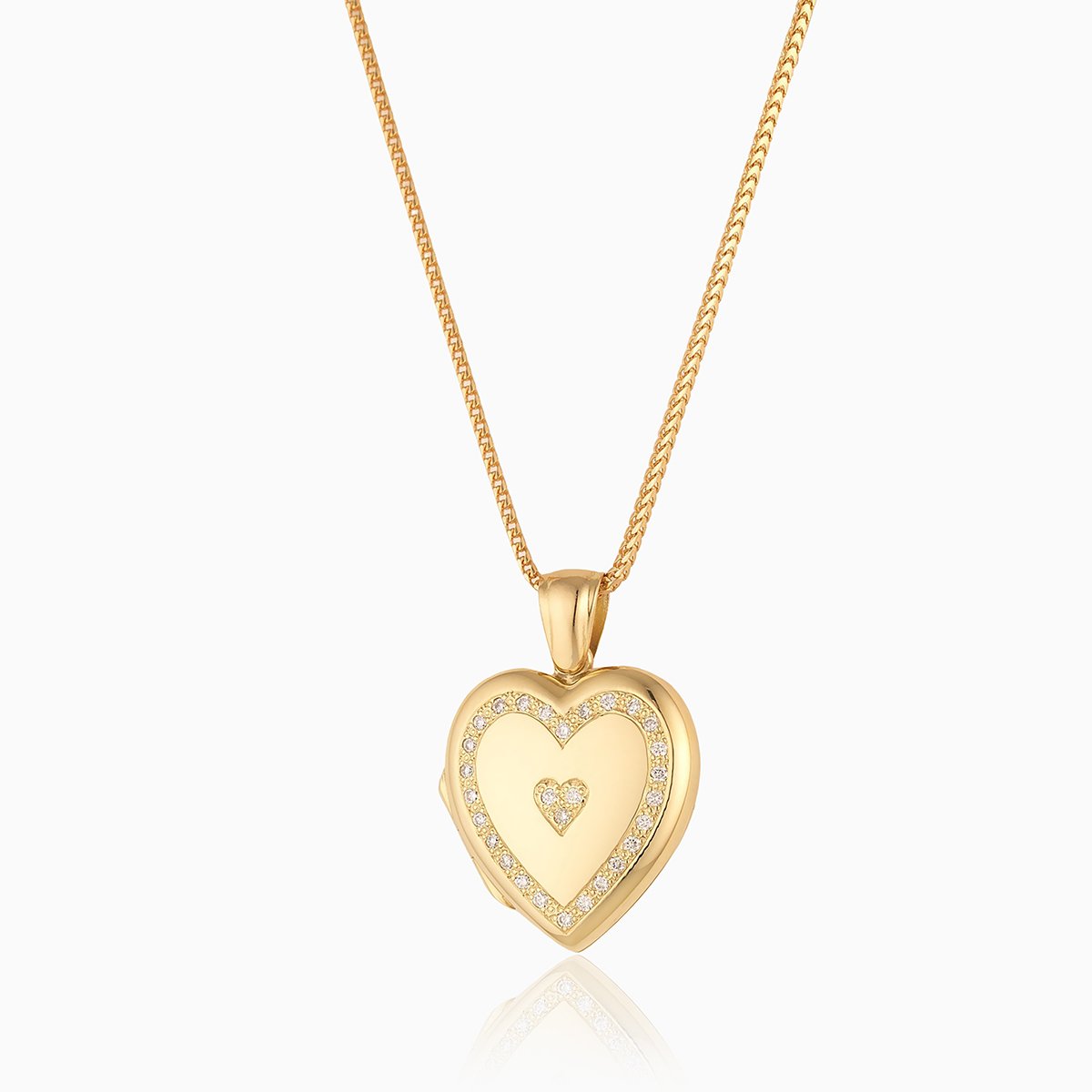 18 ct gold heart locket set with diamonds around the rim and 3 diamonds in the middle in a heart shape, on an 18 ct gold franco chain