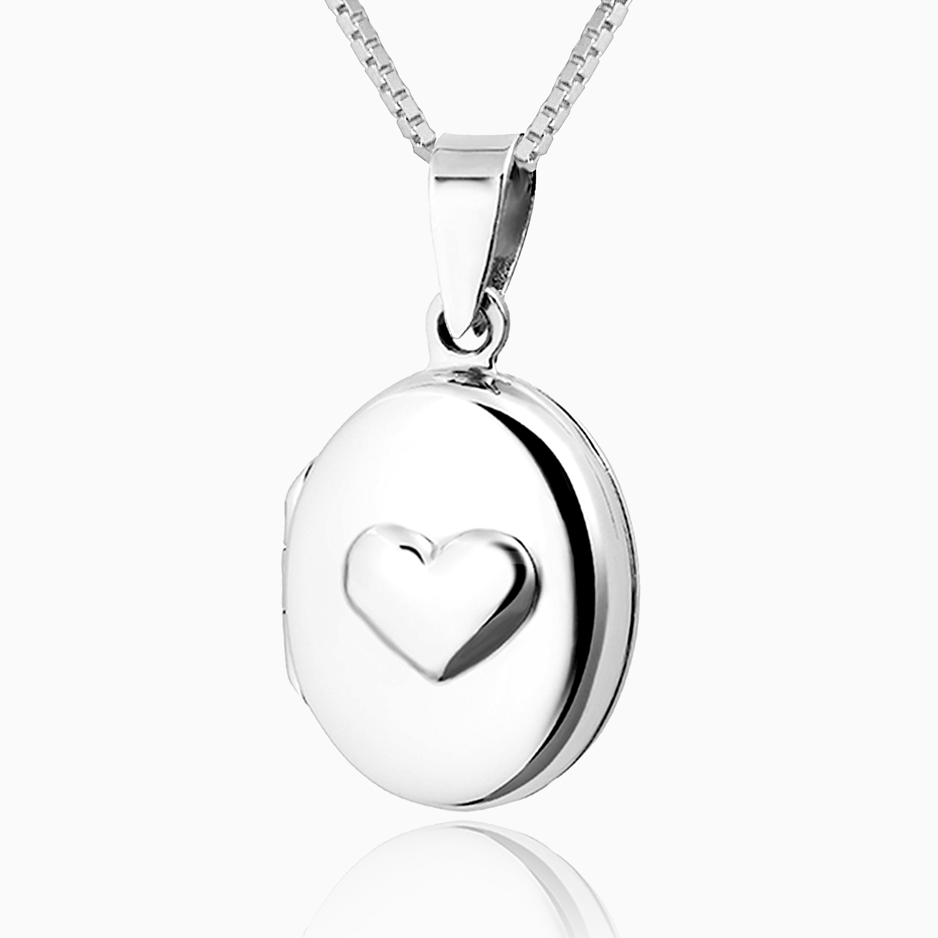Small oval sterling silver locket embossed with a heart on the front, on a sterling silver box chain.