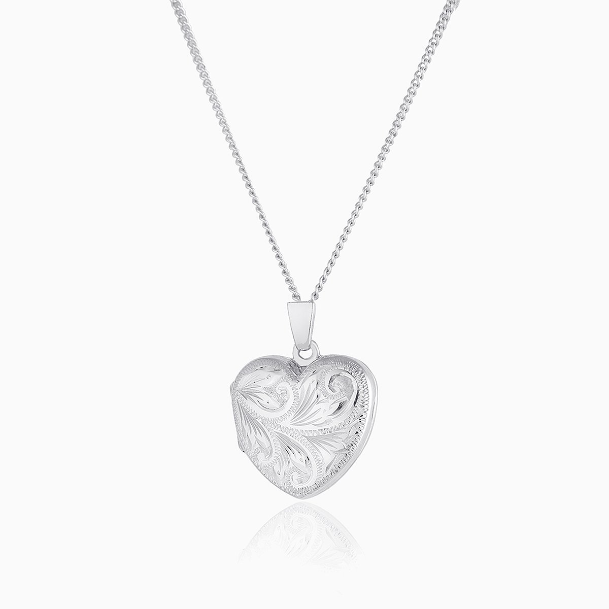 Petite 9 ct white gold heart locket engraved all over with a foliate design, on a 9 ct white gold curb chain