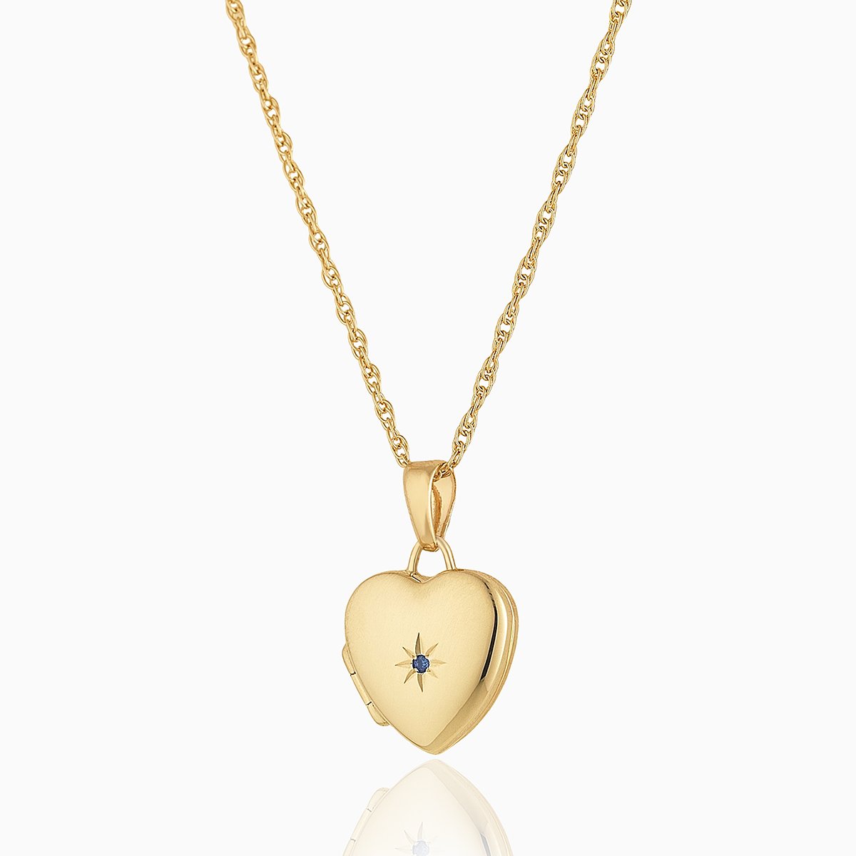 Petite 9 ct gold heart locket set with a blue sapphire on a 9 ct gold rope chain
