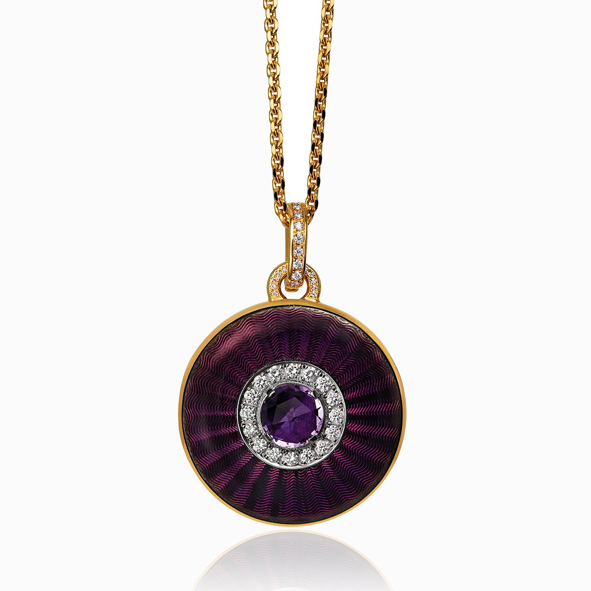 18 ct gold round locket set with purple guilloche enamel, a purple amethyst stone and diamonds. The bail is also set with diamonds. On an 18 ct gold chain.