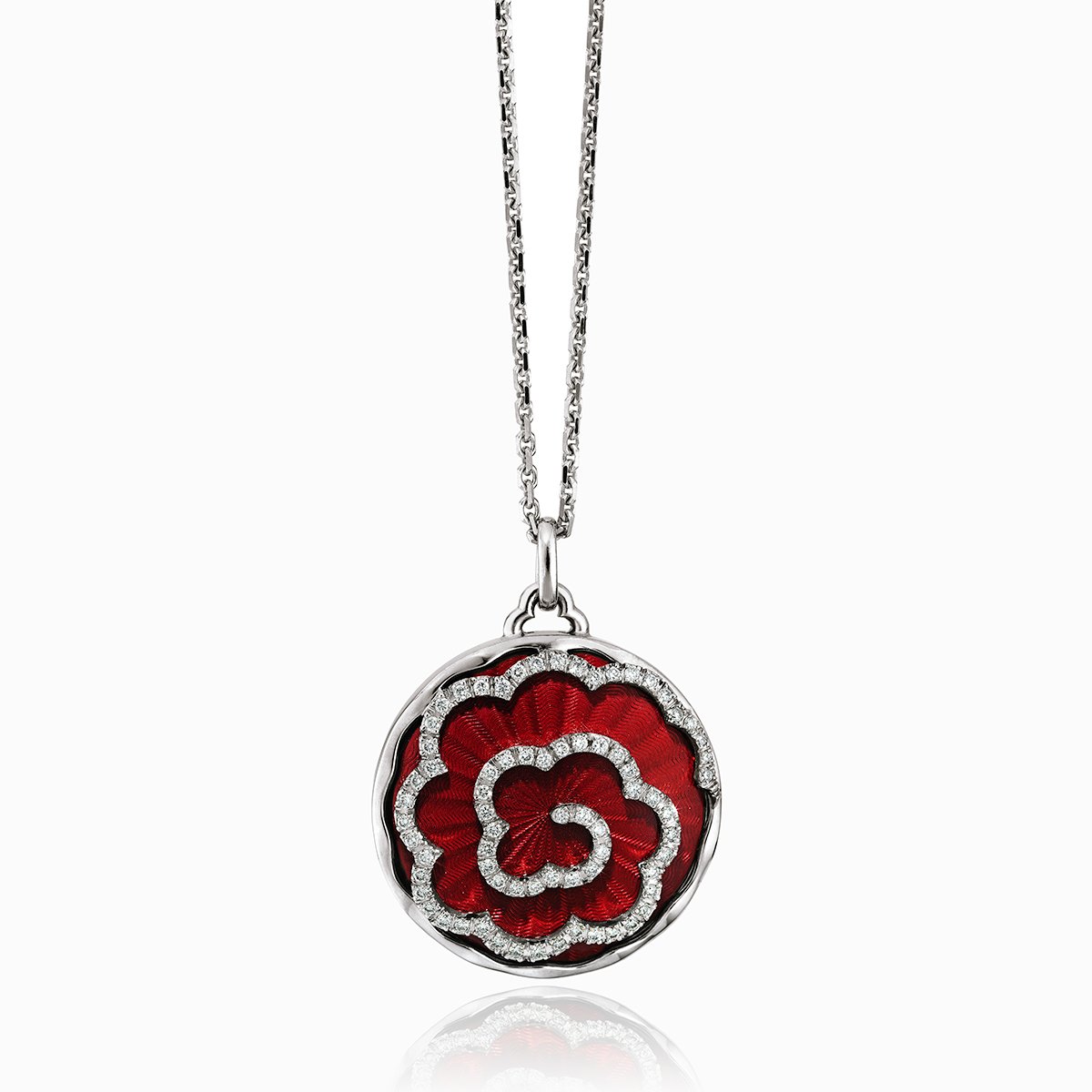 18 ct round locket with a red guilloche enamel background and daimonds aranged in a floral design on an 18 ct white gold chain