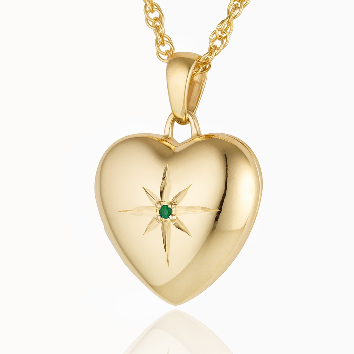 9 ct gold heart locket seti with a central emerald, on a 9ct gold rope chain