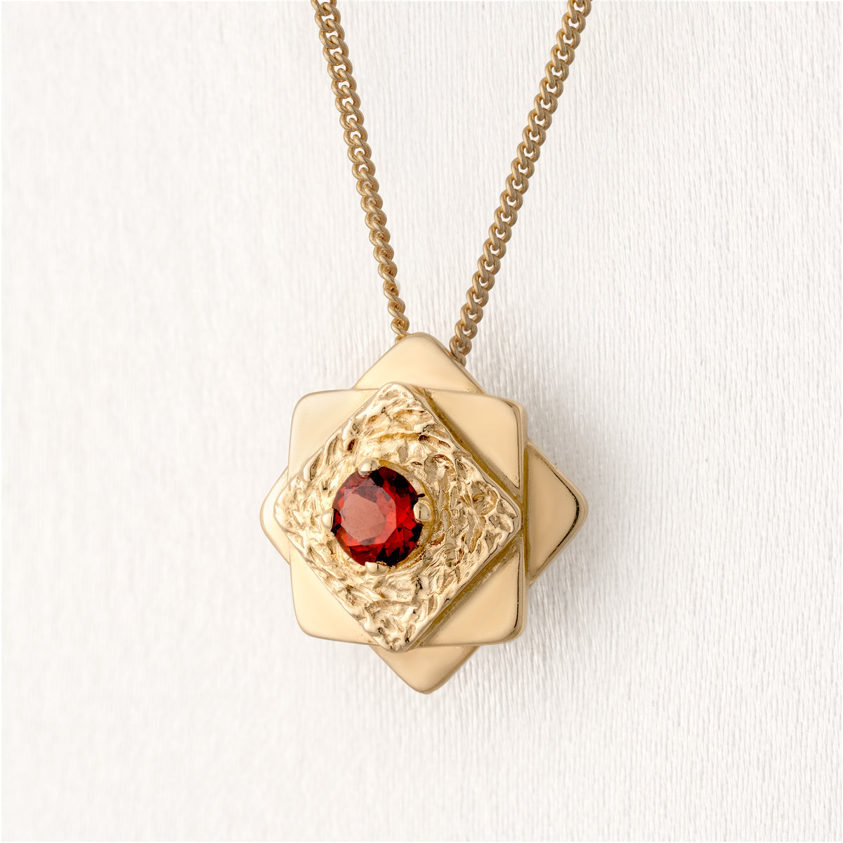 Contemporary Garnet Star Pendant
