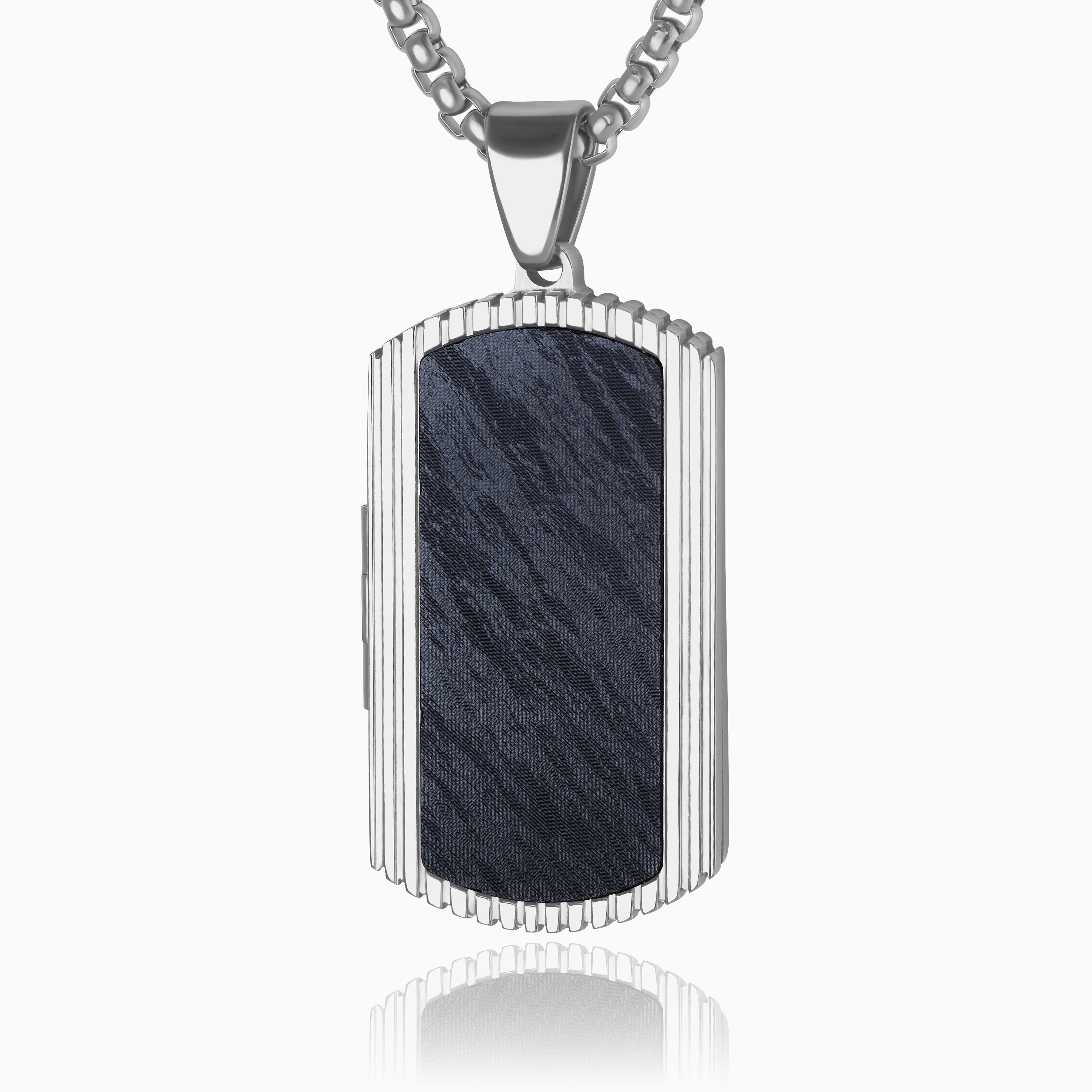 Photo of a stainless steel and forged carbon fibre men's dog tag locket with a ridged edge and dark marble background placed on sterling silver chain