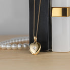 Product title: Tiny Gold and Diamond Heart Locket, product type: Locket