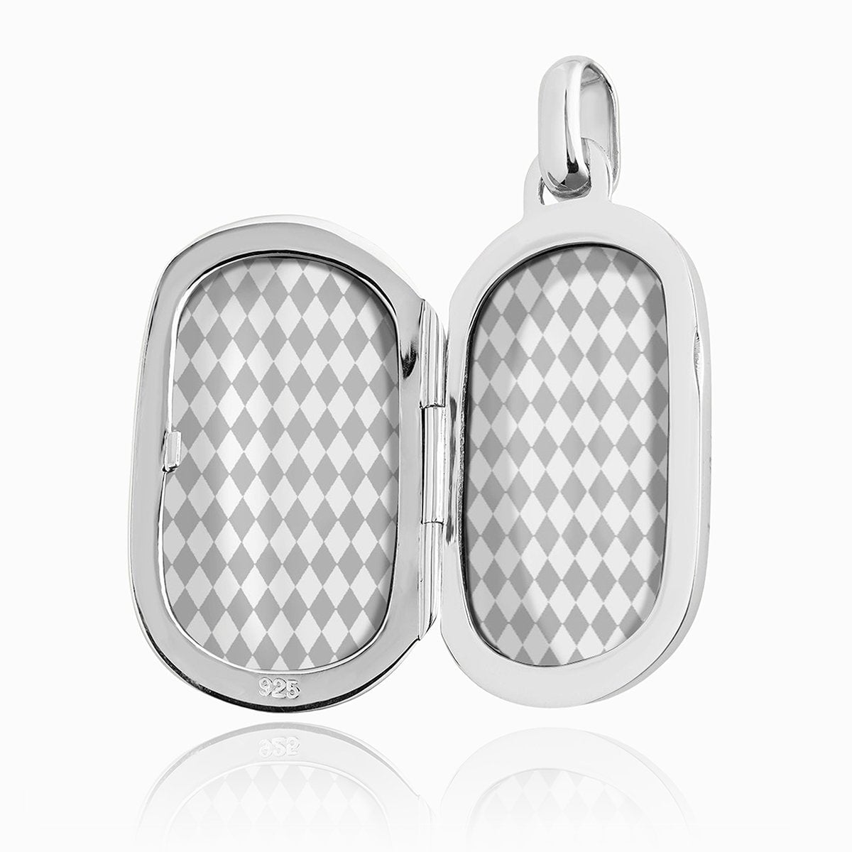 open view of a silver dog tag shaped locket showing harlequin pattern inserts