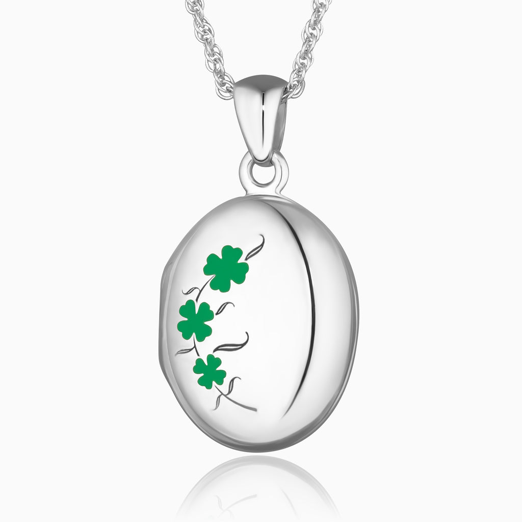 sterling silver oval locket with a green enamelled clover leaf design, on a sterling silver rope chain