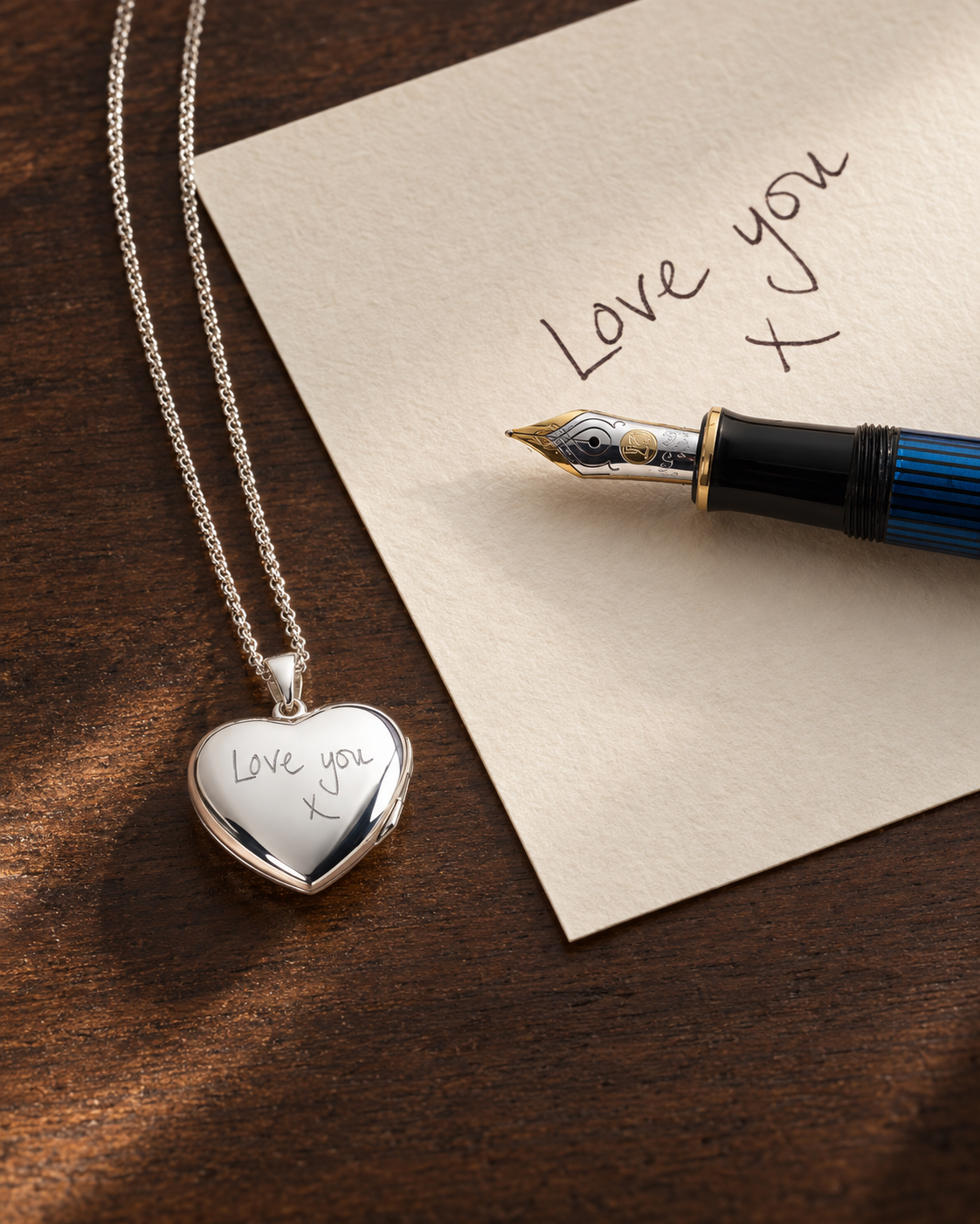 A handwritten note beside a silver heart locket engraved with the same message