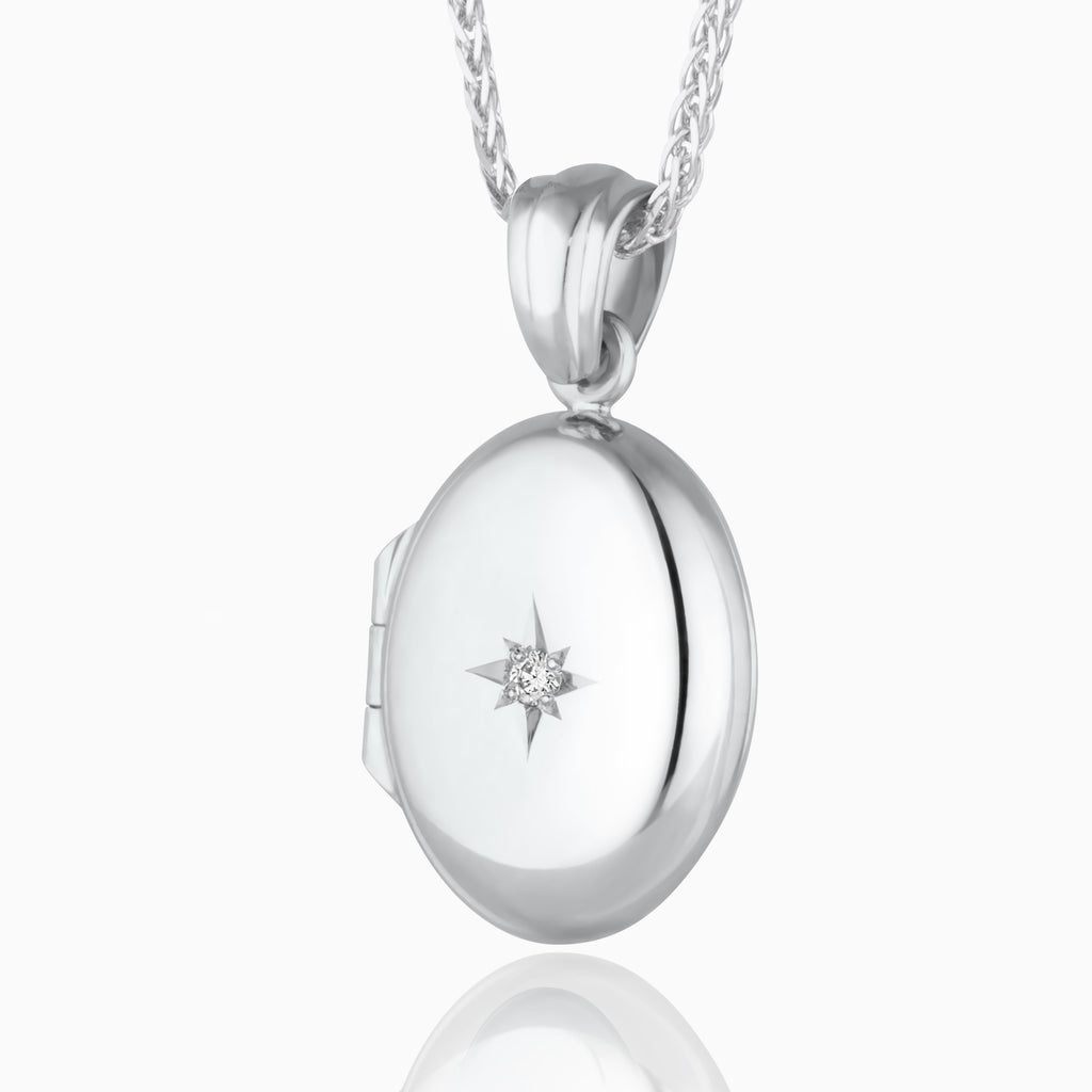 Product title: 18 ct Petite White Gold Oval Diamond Locket, product type: Locket