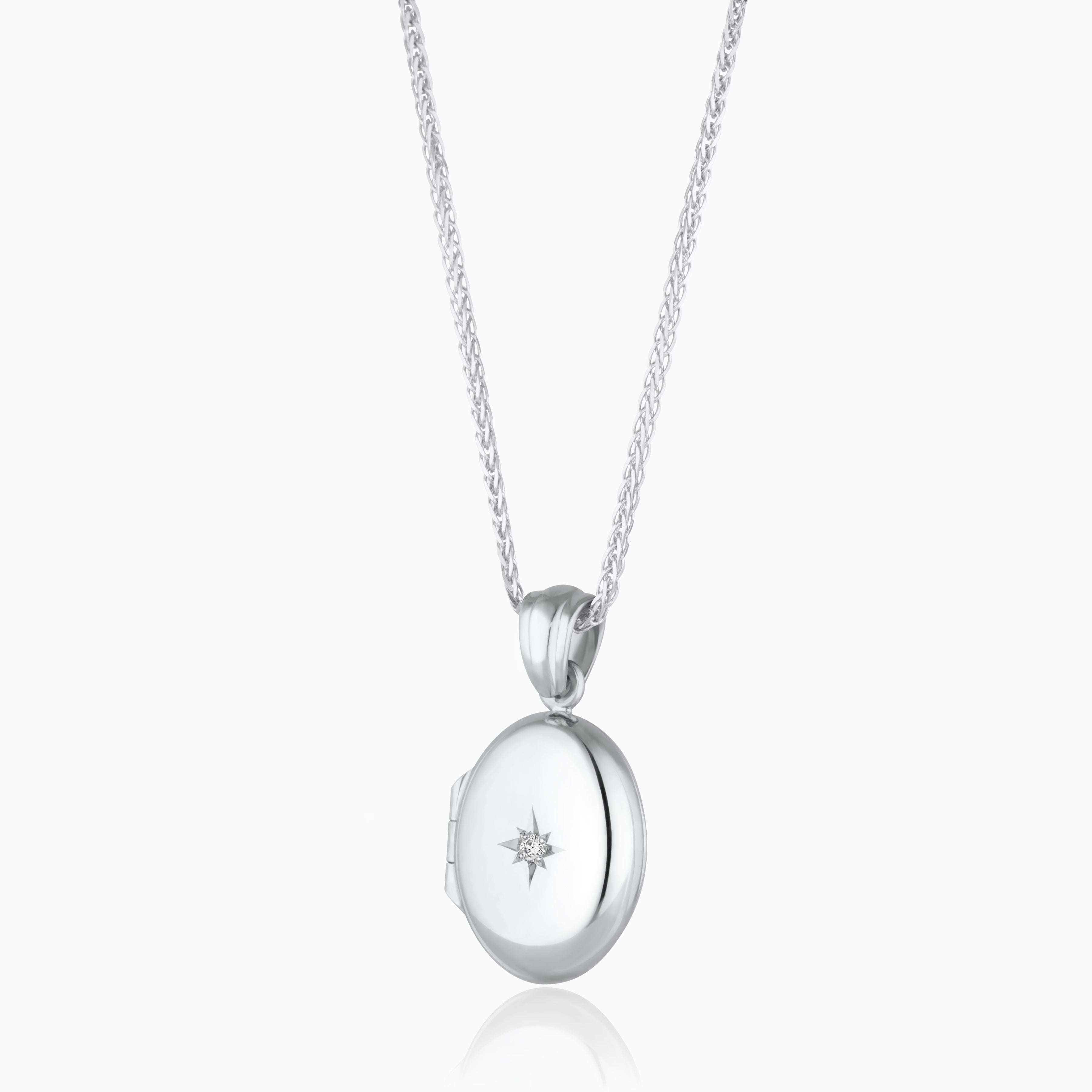 Product title: 18 ct Petite White Gold Oval Diamond Locket, product type: Locket