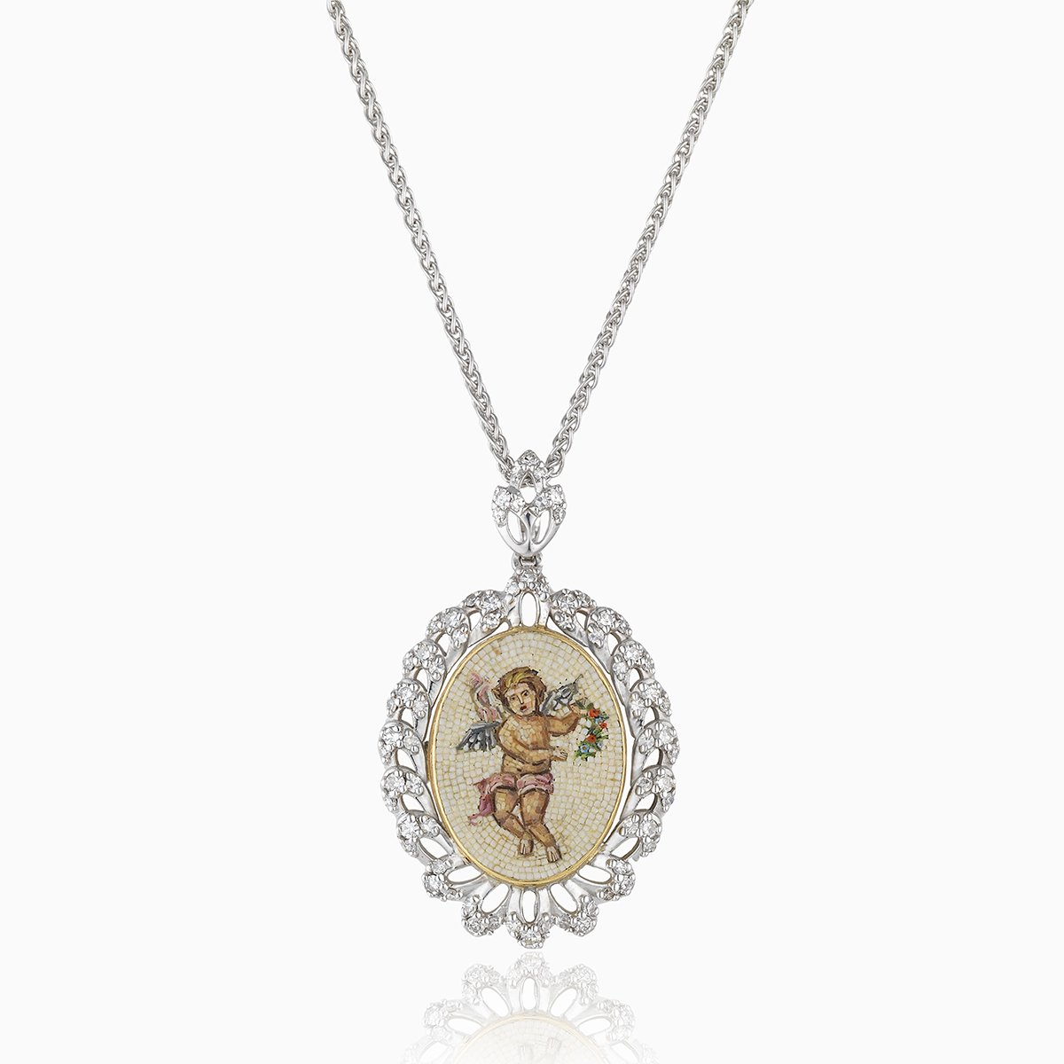 18 ct white gold locket with a micromosaic desing of a cherub with a rope twist surround set with diamonds. The bail is also set with diamonds. On an 18 ct white gold spiga chain.
