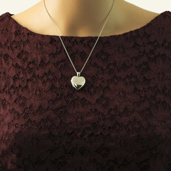 Model wearing an 18 ct white gold heart locket on an 18 ct white gold franco chain.