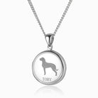 sterling silver round locket with an engraved large breed dog on the front, on a sterling silver curb chain