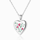 Front shot of a heart-shaped contemporary sterling silver heart locket with a vintage rose and leaves design, set on a sterling silver curb chain.