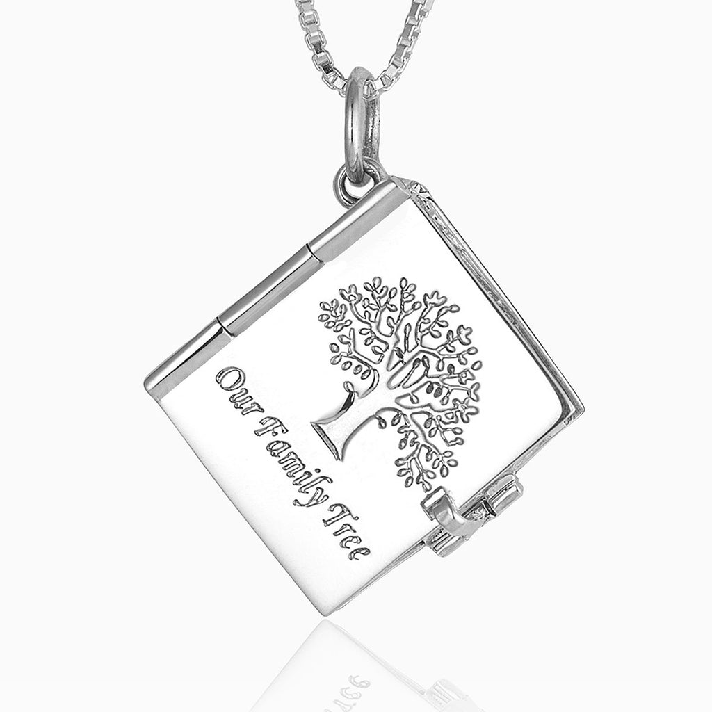 A front view of the 925 sterling silver 10 photo book album locket with a tree design and the phrase " our family tree " underneath it, on a sterling silver box chain