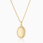 9 ct gold oval locket wiht a beaded border on a 9 ct gold rope chain