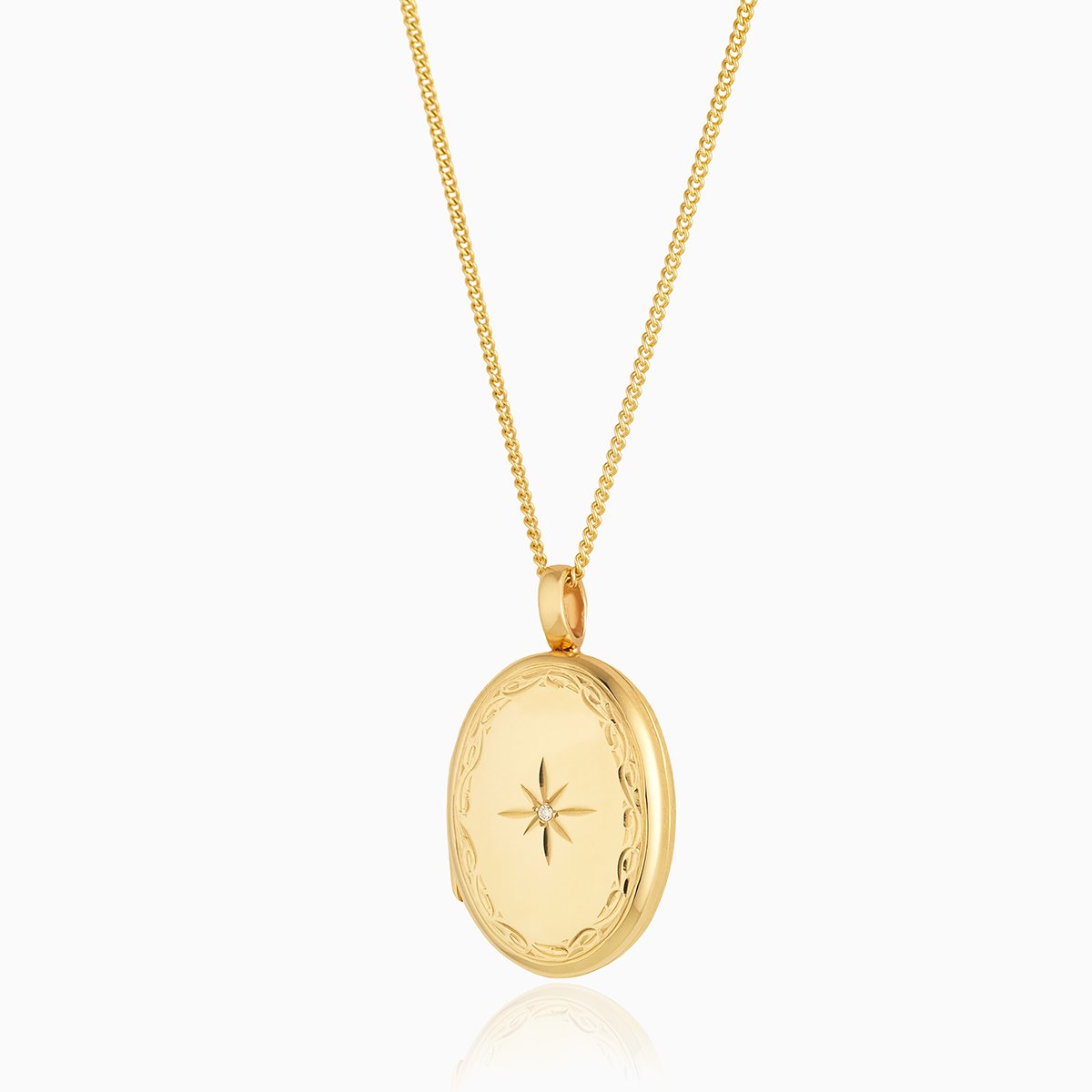Large 9 ct gold oval locket with an engraved border and diamond on a 9 ct gold curb chain.