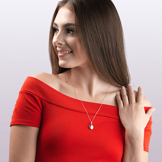 Model wearing a 9 ct gold polished oval locket on a 9 ct gold curb chain