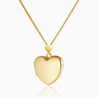 9 ct gold heart locket with a heart shaped bail, on a 9 ct gold curb chain