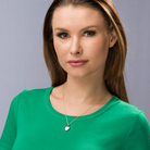 Model wearing a petite 9 ct gold heart locket set with a diamond on a 9 ct gold rope chain.