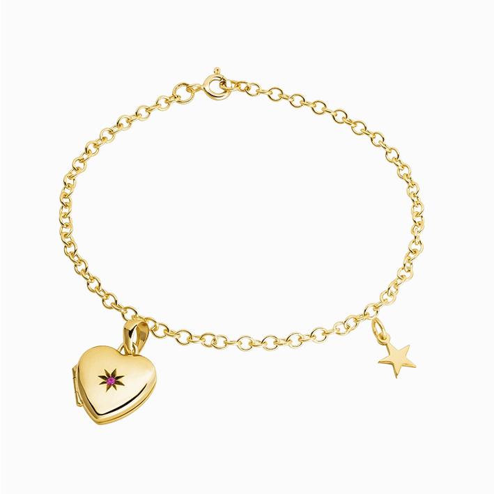 A 9 ct gold bracelet set with a 9 ct gold and ruby heart locket and a 9 ct gold star charm.