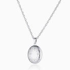 9 ct white gold oval locket engraved around the border with a foliate design, on a 9 ct white gold rope chain