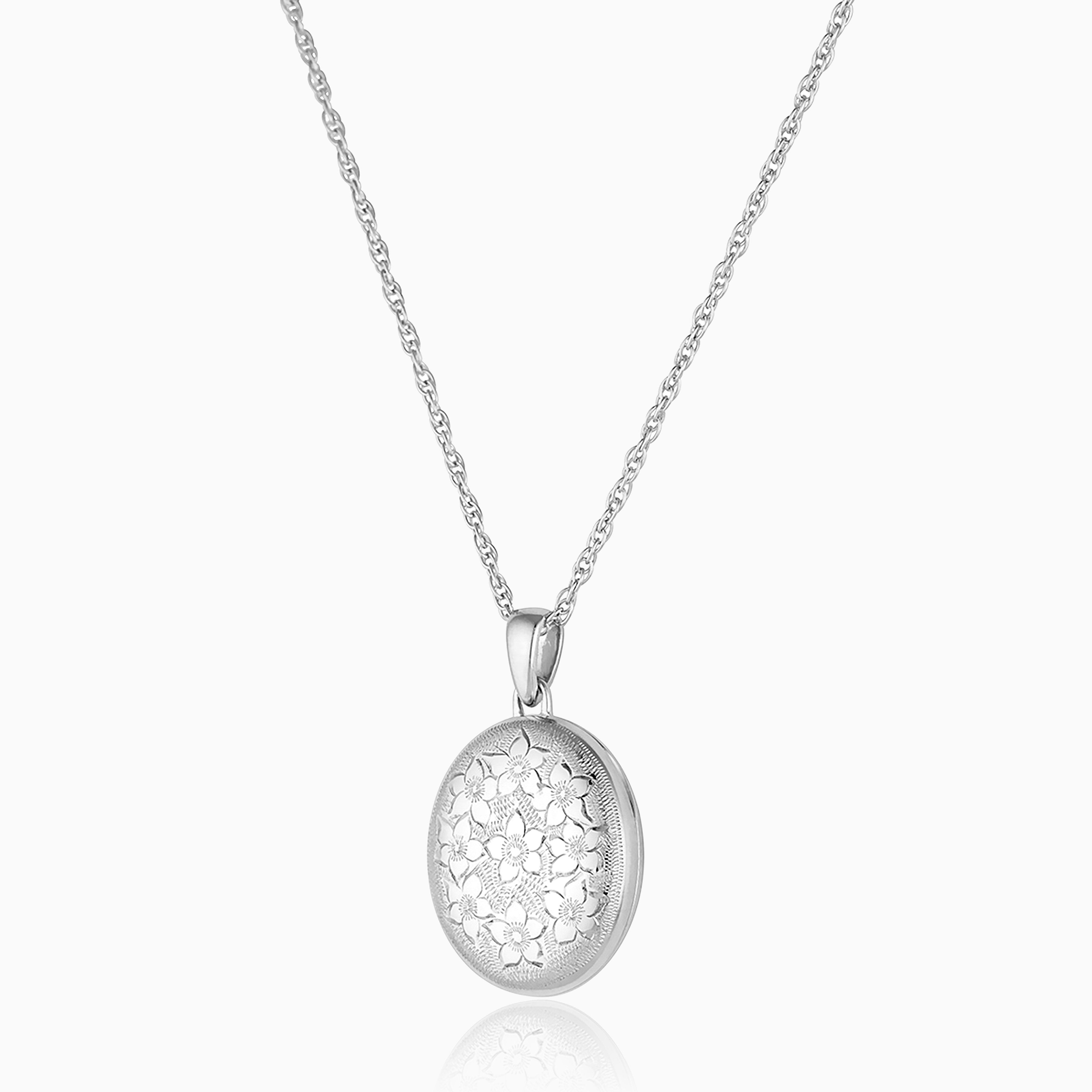 sterling silver oval locket engraved all over with a floral design, hanging on a sterling silver rope chain