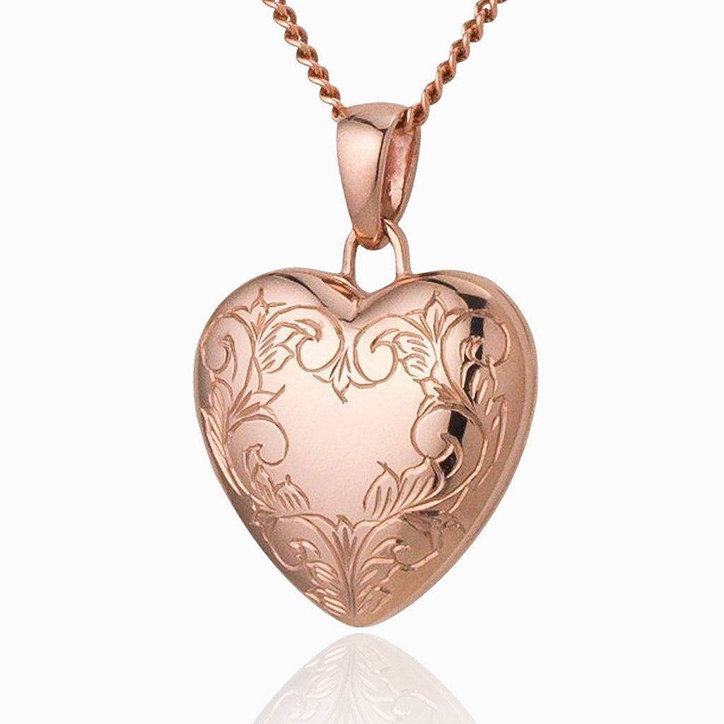 9 ct rose gold heart locket with engraved border on a 9 ct rose gold curb chain