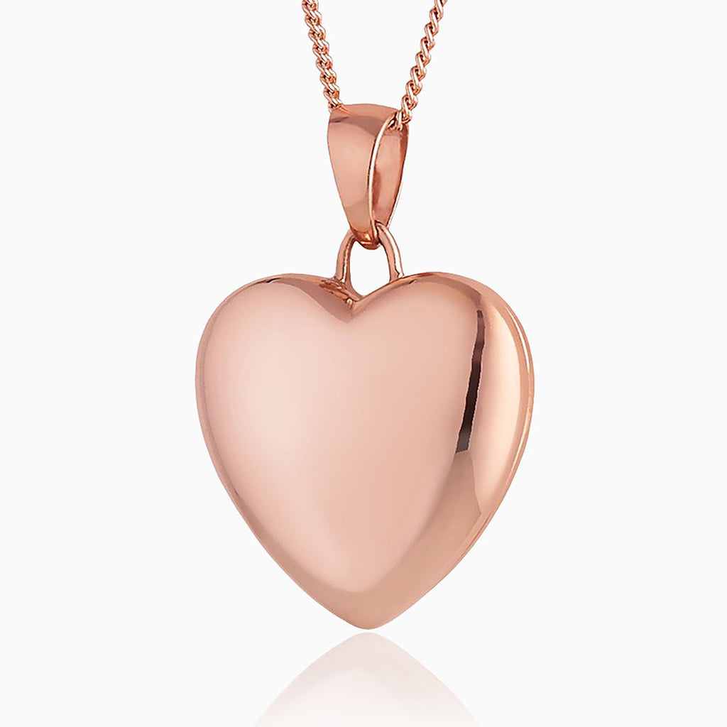 9 ct rose gold heart locket on a 9 ct rose gold curb chain